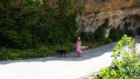 Woman-walking-her-dog-along-Mirador-al-Puente-Romano-Guadalajara-Spain