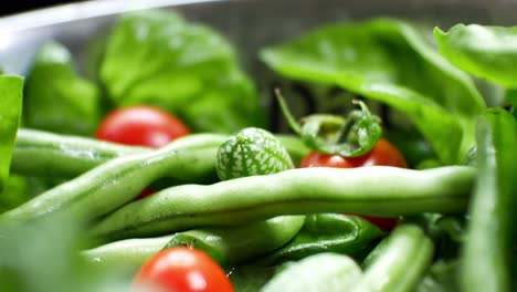 Shallow-focus-healthy-fresh-green-spinach-leaf-cucamelon-cherry-tomato-salad-bowl-closeup-dolly-left