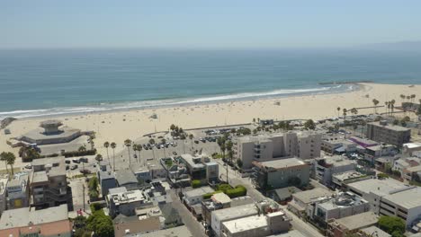 Drone-Flying-Above-Downtown-Venice-toward-Venice-Beach-in-Los-Angeles,-California