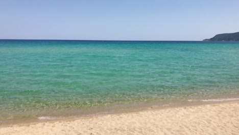 Stunning-turquoise-Mediterranean-beachfront-view-in-Sarti,-Sithonia-in-slow-motion