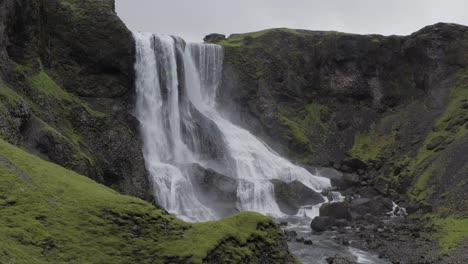 Picturesque-Landscape-Of-Fagrifoss-Waterfall-Flowing-Down-The-Icelandic-River-In-Southeast-Iceland