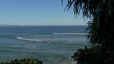 Surfers-riding-and-splashing-on-the-waves---Gold-Coast-QLD-Australia