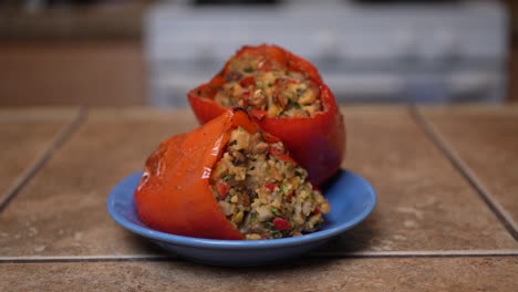 Stuffed-sweet-bell-peppers-on-a-plate-and-ready-for-that-first-mouthwatering-bite---slow-dolly-forward