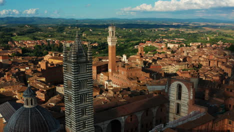 Siena,-Tuscany.-Aerial-View-flying-past-ancient-towers