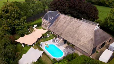 Aerial-of-beautiful-villa-with-swimming-pool-in-rural-Netherlands