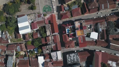 Aerial-drone-top-view-of-houses-in-the-town-of-Flores-Island-in-Peten,-Guatemala