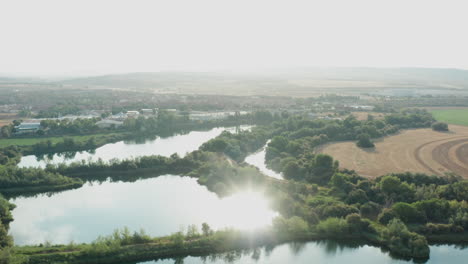 Tilt-up-aerial-shot-of-El-Picón-de-los-Conejos-wetlands-located-in-Spain