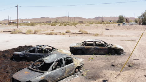Destroyed-cars-scattered-around-aftermath-of-gas-station-explosion-in-desert