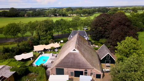 Aerial-of-beautiful-farmhouse-in-rural-Netherlands