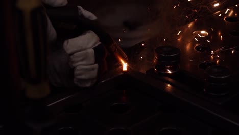 Man-is-welding-two-metal-pieces