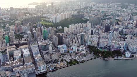 Hong-Kong-bay-and-skyline-with-skyscrapers,-late-afternoon-scene