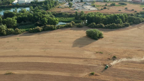Agricultural-Landscape-in-Madrid,-Spain---Farm-Tractor-Plowing-Land,-Aerial-Drone