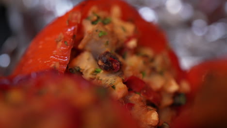 Macro-view-of-stuffed-red-bell-peppers-oozing-with-tasty-filling---rack-focus