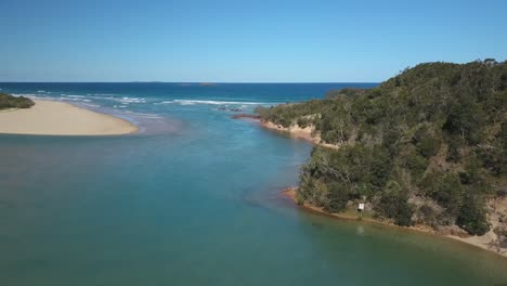 Aerial-shot-over-Corindi-River-estuary-in-New-South-Wales,-Australia