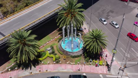 Snake-like-fountain-in-Mixcoac-neighborhood-in-Mexico-City-between-a-busy-street-interjection