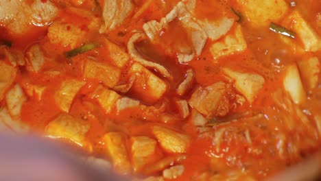 POV-to-the-pot-full-of-korean-food--heated-kimchi-soup
