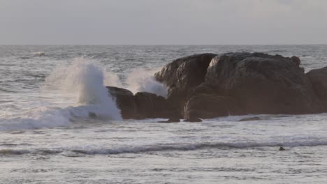 ocean-wave-Crashing-on-to-rocks-in-evening-Galle-fort-Seashore-Slow-motion-b-roll-clip