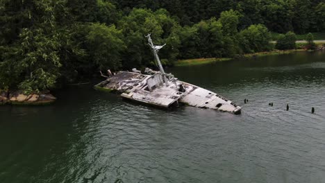 Aerial-orbit-around-shipwreck-of-USS-Plainview-military-ship-ruins-in-Columbia-River