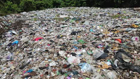 Aerial-dolly-downward-tilt-shot-of-a-garbage-landfill-site-in-Thailand