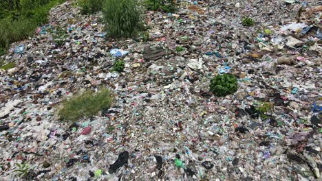 Aerial-tilt-shot-of-a-garbage-dump-on-a-tropical-Island-in-Thailand