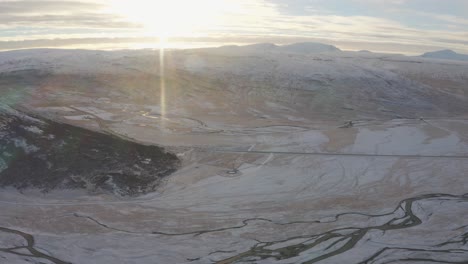 Incredible-Rivers-Run-through-Snow-Capped-Mountainous-Valley-in-the-Westfjords-of-Iceland,-Drone-Aerial