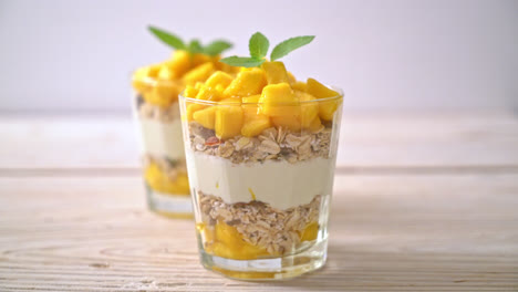 fresh-mango-yogurt-with-granola-in-glass---healthy-food-style