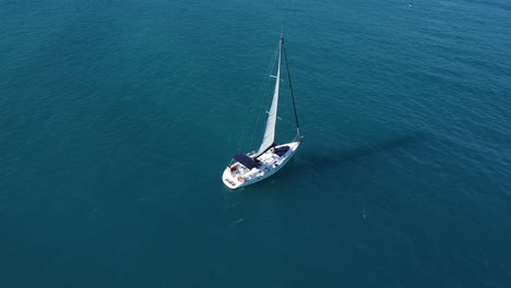 Aerial-drone-shot-for-a-sailing-luxury-boat-in-the-middle-of-the-sea