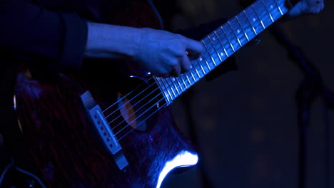 Close-up-shot-of-a-person-playing-a-guitar-at-the-El-Dorado-County-Fair