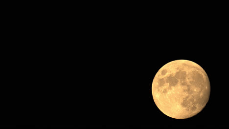 Orange-Full-Moon-Time-Lapse,-Isolated-In-The-Night-Sky
