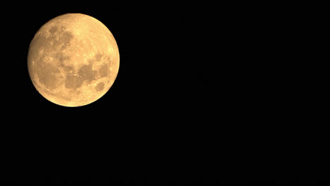 Closeup-Time-Lapse-Of-Full-Moon-Illuminated-In-The-Night-Sky