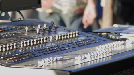 Steady-close-up-shot-of-a-person-moving-the-buttons-on-a-synthesizer