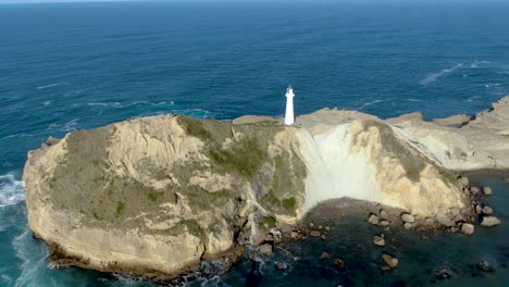 Aerial---Lighthouse-Tower-in-Castlepoint,-New-Zealand,-Static-Drone-View