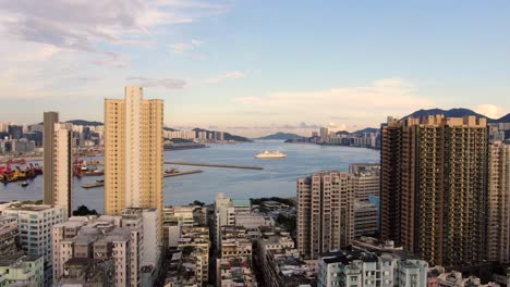 Hong-Kong-bay-and-skyline-with-skyscrapers,-high-altitude-wide-shot