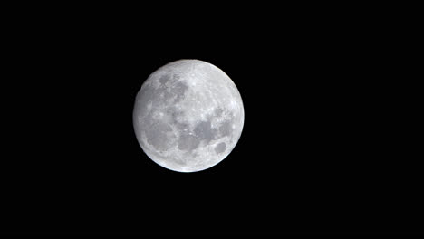 Closeup-Of-Illuminated-Full-Moon-Setting,-Nightscape-Time-Lapse