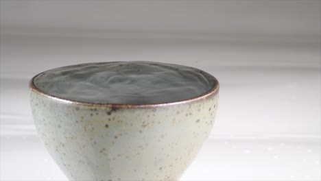 vibration-of-sake-in-ceramic-glass