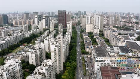 Busy-Shanghai-city-road-in-residential-suburb,-aerial-view