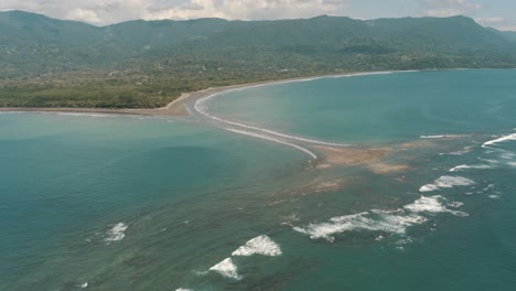 Drone-aerial-wide-view-of-whale-tail-beach-Marino-Ballena-National-Park-in-Uvita,-Costa-Rica