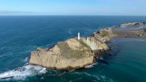Castlepoint-Lighthouse-Tower-on-North-Island-of-New-Zealand---Aerial-Drone-Pullback