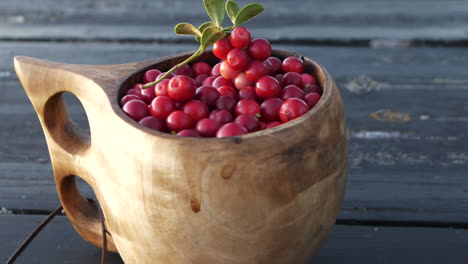 Healthy-lingonberries-in-traditional-wooden-cup
