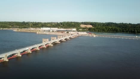 Wide-aerial-view-of-Lock-and-Dam-14-on-the-Mississippi-River-on-a-sunny-summer-day,-near-Hampton-Illinois