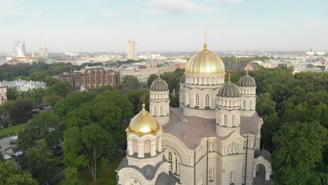 Scenic-aerial-top-view-of-Riga-with-majestic-Nativity-Cathedral,-Latvia,-drone-flying-forward,-sunny-day