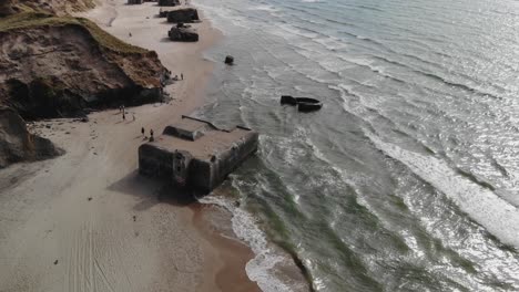 Aerial-of-old-German-world-war-2-bunkers-on-the-beach-shore-of-the-west-coast-of-denmark