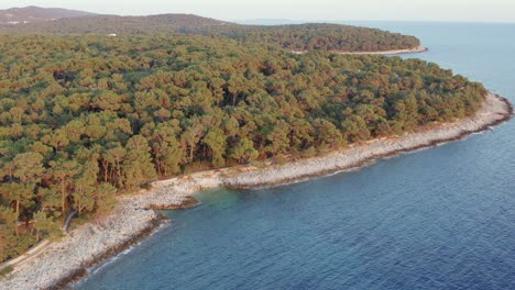Aerial-circling-shot-around-the-coast-of-Losinj-Island,-Croatia-during-the-day