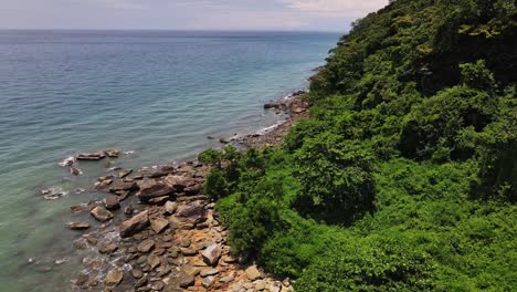 drone-forward-dolly-shot-of-rocky-coastline-on-a-tropical-Island-in-Thailand
