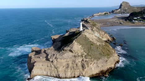 Lighthouse-Serving-as-Navigation-Safety-Beacon-on-New-Zealand-Coast---Aerial-Rotating-View