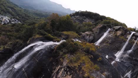 FPV-drone-shot-diving-down-a-waterfall-90-fps-slow-motion-action-cam