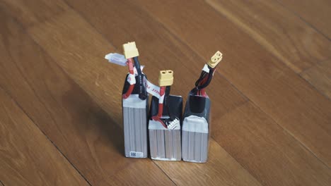 Three-lithium-polymer-batteries-standing-with-connectors-in-the-sky