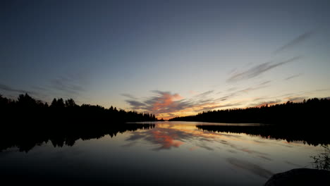 Time-Lapse-of-Pure-Nordic-nature,-calm-summer-lake-and-evening-clouds