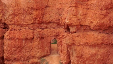 Tilt-down-from-Bryce-Canyon-rock-formations-to-rock-passage-way-on-trail