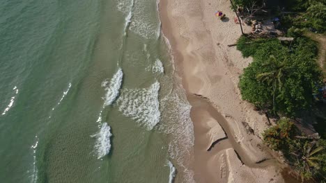 Aerial-drone-dolly-shot-of-jungle-with-beach-and-ocean-waves